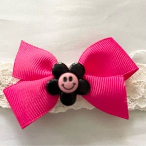 Infant size hot pink bow on white lace headband